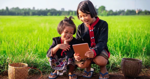 Image of 4 people standing in front of the DevEd 2025 banner
